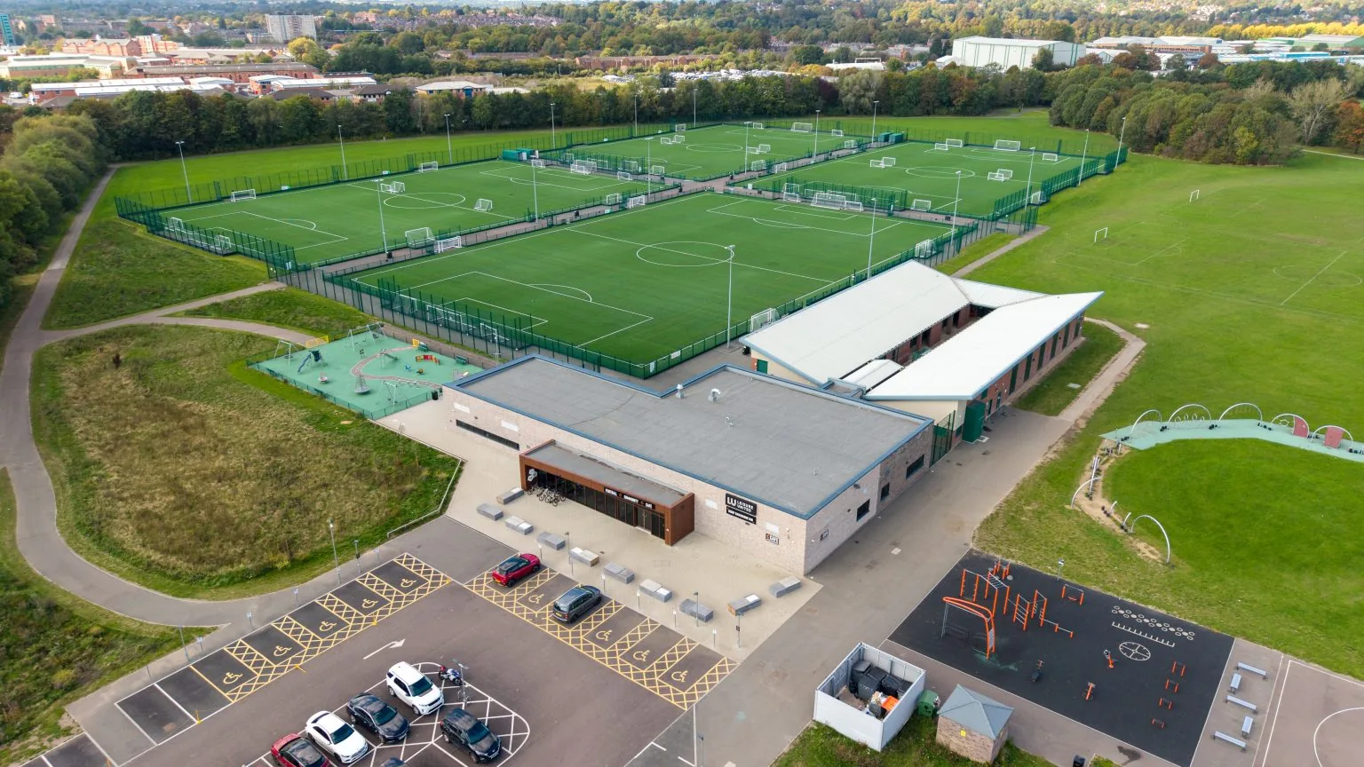 Aerial view of the 3G pitches and hub building at Derby Racecourse