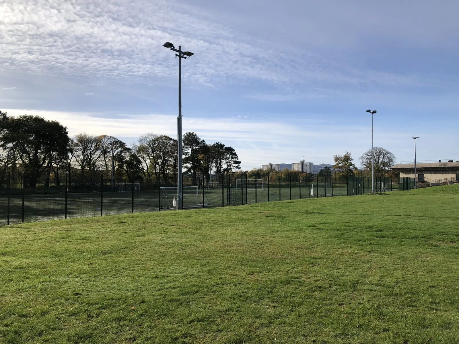 Grass and fenced pitches at Jack Kane Sports Centre, Niddrie