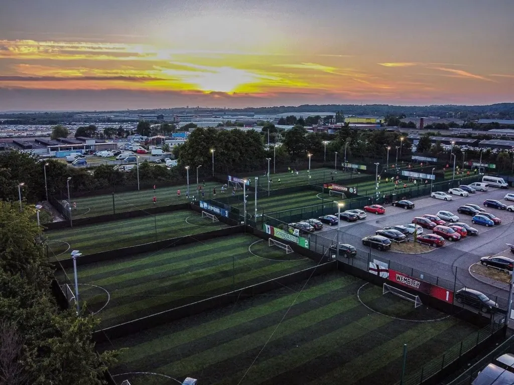 Floodlit pitches at GOALS Liverpool South at dusk