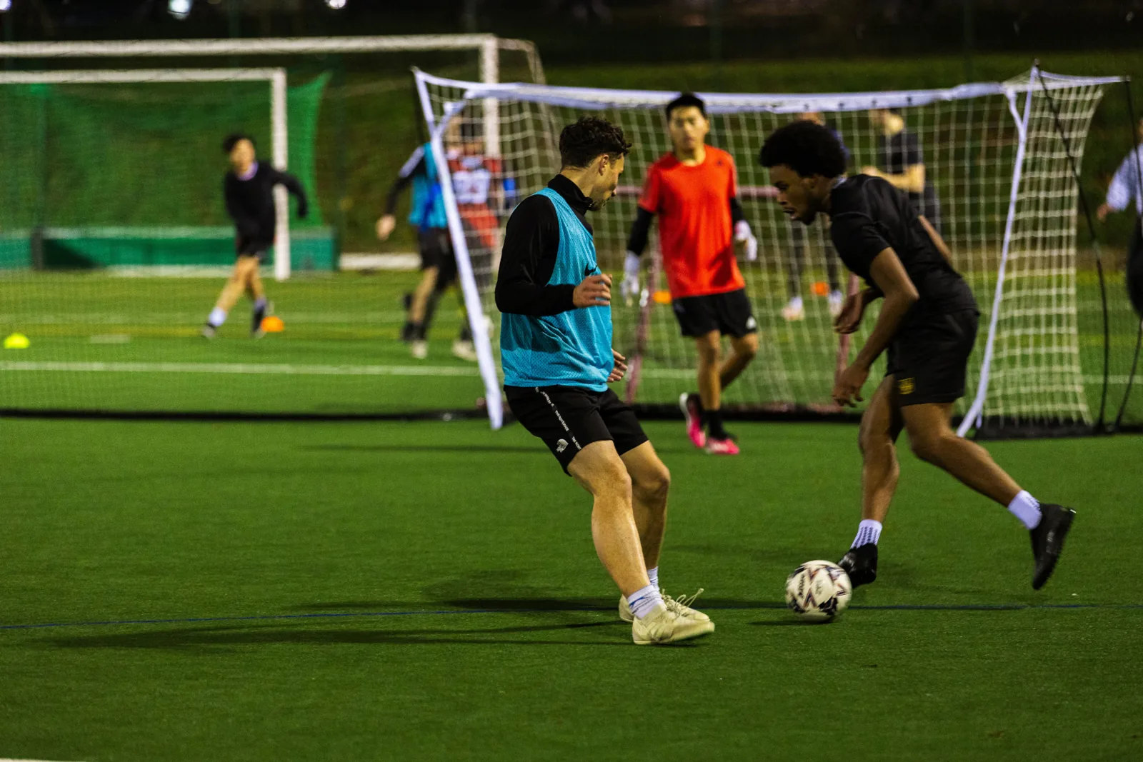 Evening football on the floodlit artificial pitch at University of Reading SportsPark