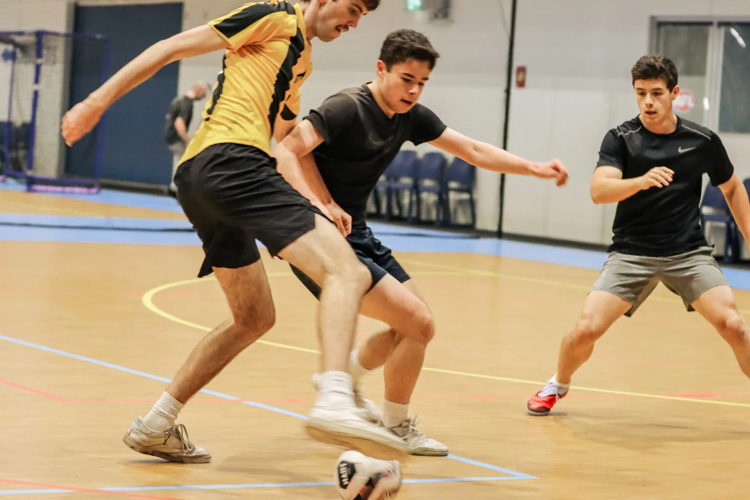 Futsal competition game on an indoor court at UniActive, University of Wollongong